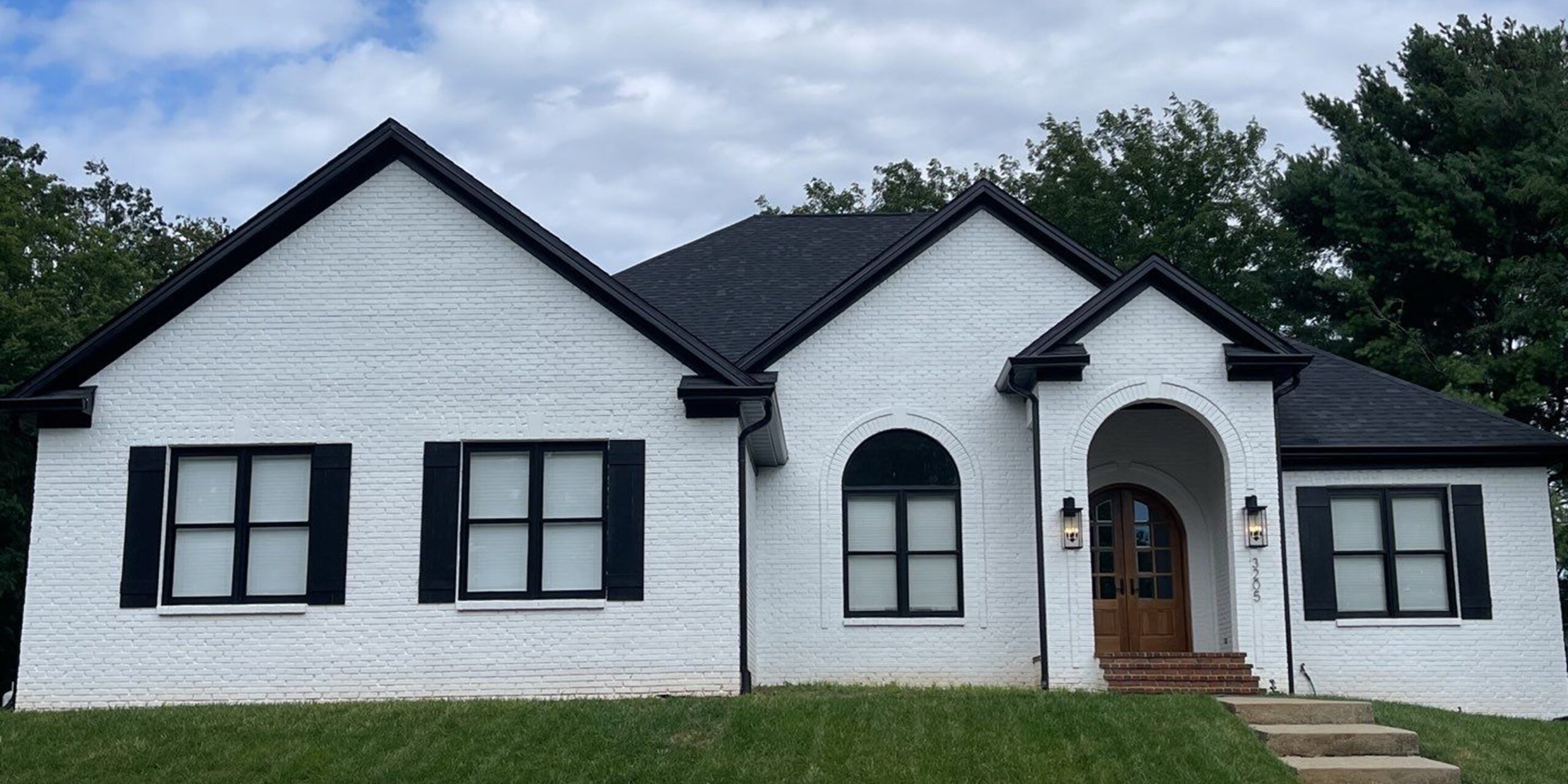 Lime washed outlet brick house