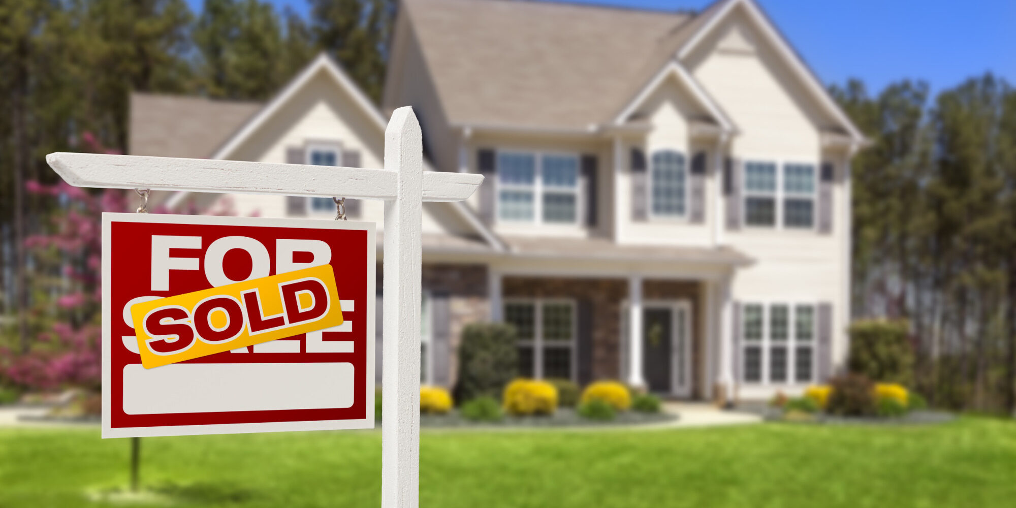 Sold Home For Sale Real Estate Sign and Beautiful New House.